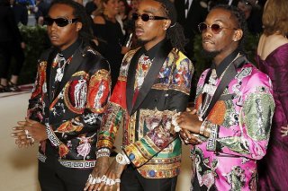 Takeoff, à gauche, avec son groupe Migos, en 2018.