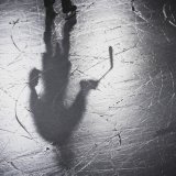 Image d'illustration - L'ombre d'un hockeyeur durant la Coupe Spengler à Davos